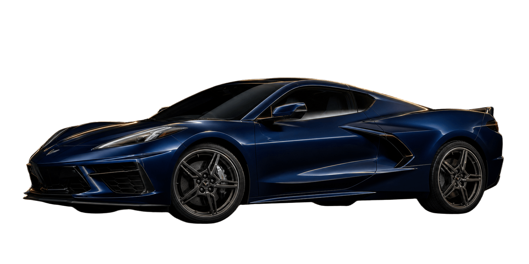 Midnight Blue Chevrolet Corvette C8 Stingray mid-engine coupe under warm gold rim lighting in a dark studio.