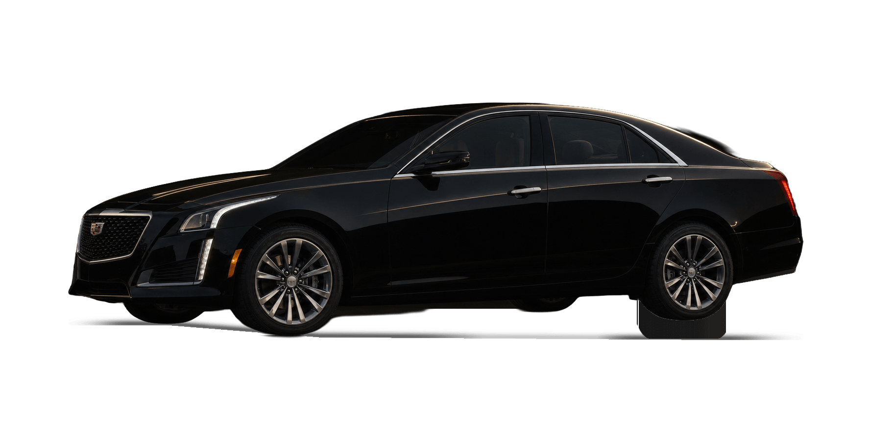 Black Cadillac CTS sedan under warm gold rim lighting in a dark studio.