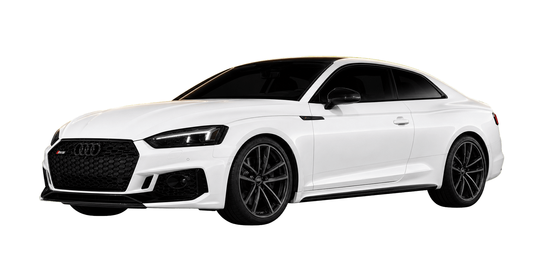 White Audi RS5 under warm gold rim lighting in a dark studio.
