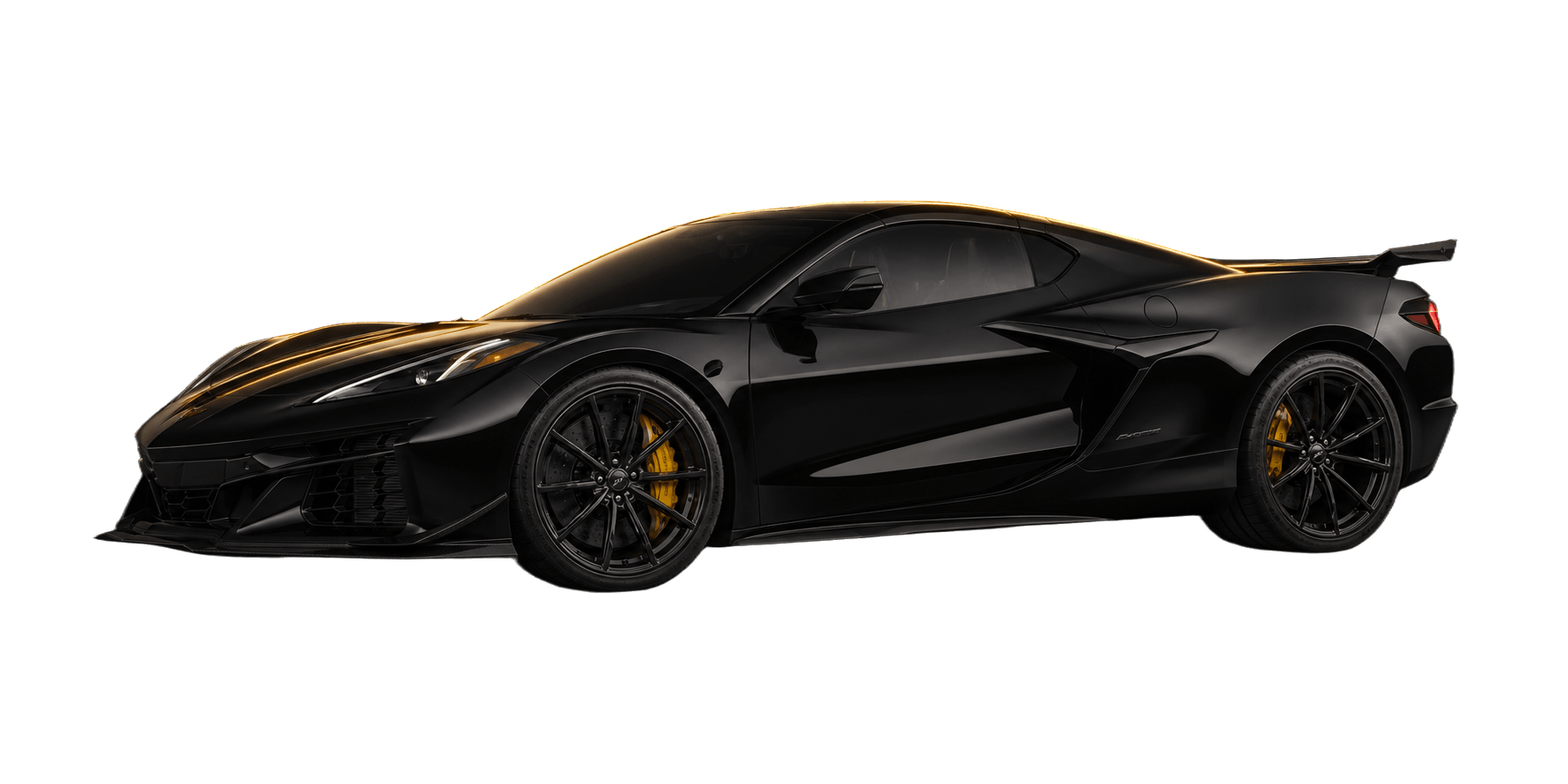 Onyx black Chevrolet Corvette C8 Z06 mid-engine coupe under dramatic gold edge lighting.